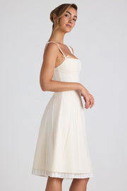 Oh Polly Isadora robe midi plissée ivoire col bardot