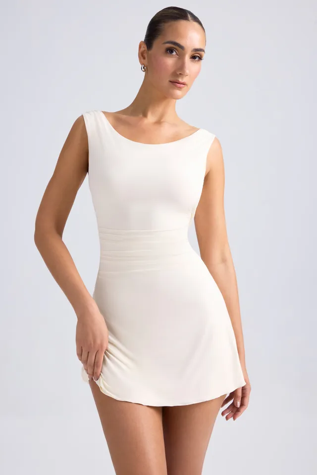 Oh Polly Tigen robe mini ivoire dos ouvert jersey