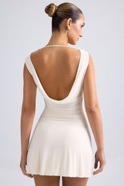Oh Polly Tigen robe mini ivoire dos ouvert jersey