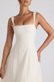 Oh Polly Isadora robe midi plissée ivoire col bardot