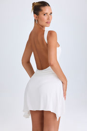 Oh Polly Shirin robe mini blanche dos nu moulante