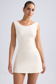 Oh Polly Tigen robe mini ivoire dos ouvert jersey
