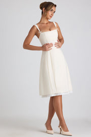Oh Polly Isadora robe midi plissée ivoire col bardot