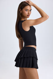 Oh Polly Nada 11517 mini jupe noire plissée taille basse