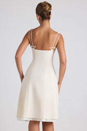 Oh Polly Isadora robe midi plissée ivoire col bardot